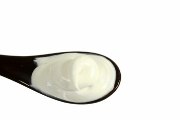 close up of skin care cosmetic beauty cream or lotion in  spoon isolated on white background with Copy space 