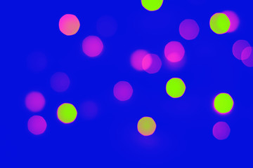 Abstract blur bokeh background. Defocused bokeh colorful background. Soft color blur on a black background. Beautiful colored bokeh lights
