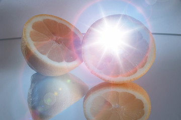 Lemon slices on mirrored surface