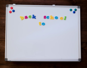 School white board with magnetic letters Back to school.