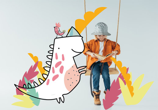 cute kid in jeans and orange shirt sitting on swing and reading book on grey background with fantasy bird and dinosaur illustration