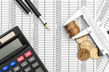 Vernier caliper with coins, calculator and pen on documents with financial data. Business and...