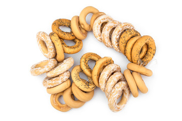 Bunch of drying bagels on white. Top view.