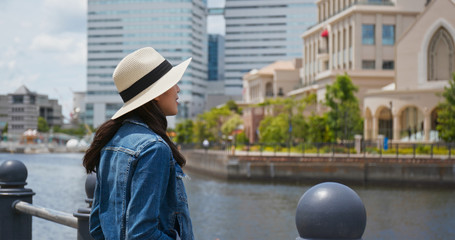 Woman look around the city in yokohama
