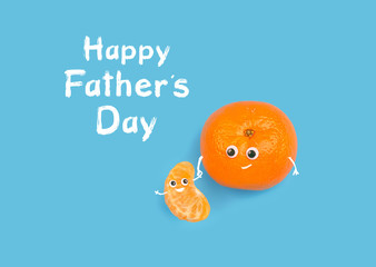 happy Father's day. creative concept congratulations on Father's day holiday. funny Mandarin and clove, son and father. tangerine family. minimalism style. close up