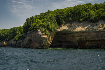 view from the lake at beautiful rocky cliff and forest , Pictured Rocks National Lakeshore