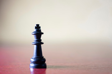 Chess piece on the table, bokeh in the background