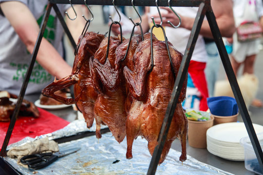 Smoked duck hanging in the air in a street cafe