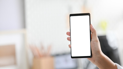 Woman's hand holding smartphone mockup mobile.