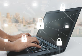 Woman hand is typing to the laptop keyboard with with key locked icon for security concept