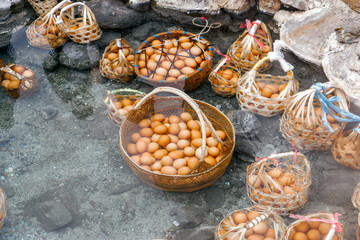 A basket of eggs for tourists that are boiled in mineral and natural hot water at Chae Son National Park, Lampang, Thailand.