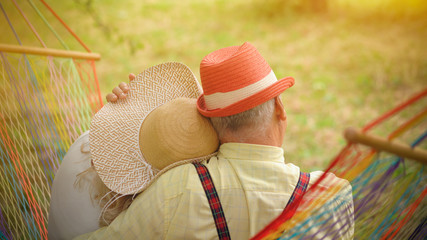 The Old Couple Is Sitting In The Hammock In The Garden4