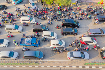 Hectic traffic with crowded cars and motorcycles