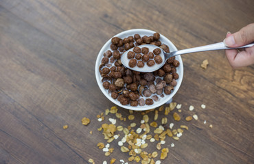 Corn flakes with milk in the cup