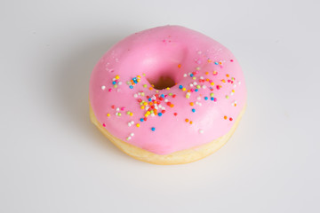 Donut. Sweet icing sugar food. Dessert colorful snack. Glazed sprinkles. Treat from delicious pastry breakfast. Bakery cake. Doughnut with frosting. Baked unhealthy round.