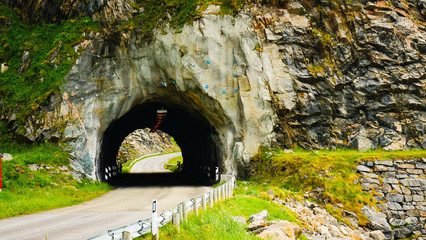 Road with old tunnel in mountains Norway