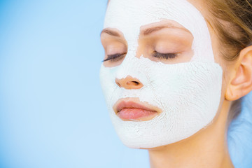 Girl with dry white mud mask on face