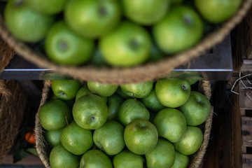 Organic fruits stall at a farmer's market and selling fresh fruits from garden. Ripe organic apples...