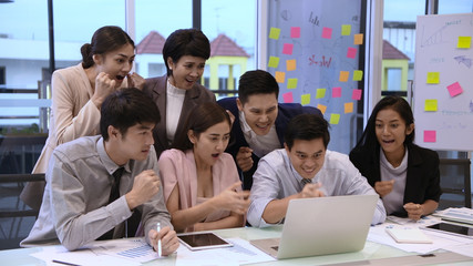 Business concept. A group of businessmen are glad about the success of the company.