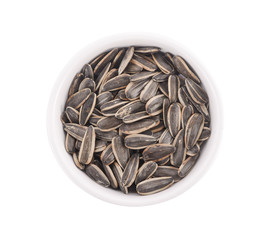 Healthy sun-flower seeds on a white background