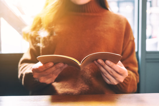 Closeup image of a woman enjoyed reading a book