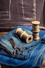 Closeup of cloth and needle in tailoring workshop