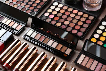 Set of different decorative cosmetics on table. Professional makeup products