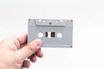 holding tape cartridge on white background.