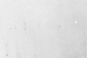Texture of a concrete wall with cracks and scratches which can be used as a background