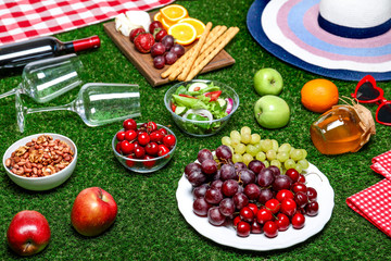 Many different products on green grass. Summer picnic