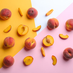Flat lay composition with fresh peaches on color background