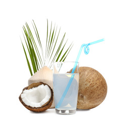 Glass of coconut milk and nuts on white background