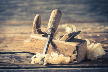 Chisel and planer in a carpentry rustic workshop - obrazy, fototapety, plakaty