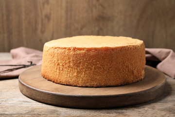 Delicious fresh homemade cake on wooden table