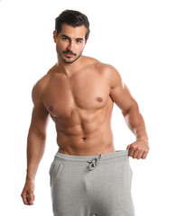 Fototapeta premium Young man with slim body on white background