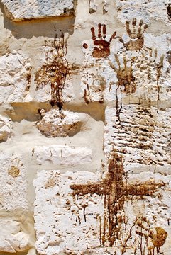 Bloody handprints and crosses