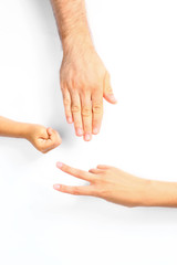 Family playing rock, paper and scissors on white background, closeup