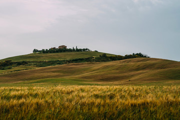 Beautiful idyllic Tuscany landscape with farmhouse in the hills, Italy. Top eco tourism and travel in Italy.