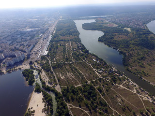 Aerial drone view of Kiev cityscape, Dnepr river.