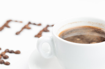 Coffee beans and coffee cup isolated on white background.Coffee time.Copy space.