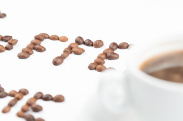 Coffee beans and coffee cup isolated on white background.Coffee time.Copy space.