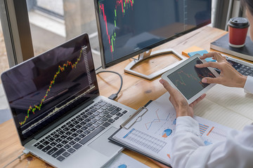 Business team investment trading do this deal on a stock exchange developing new approaches.