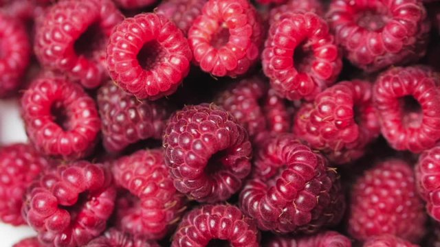 Close Up Rotation Loopable Berry. Fresh, Juicy Raspberry Background, Ripe. Macro Red Raspberries Fruit. Fresh Raspberry Fruits As Food Dackground. Healthy Food Organic Nutrition.