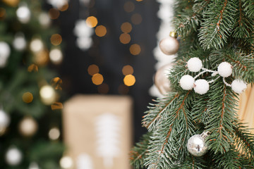 Christmas tree background. New Year composition with spruce, balls and lights