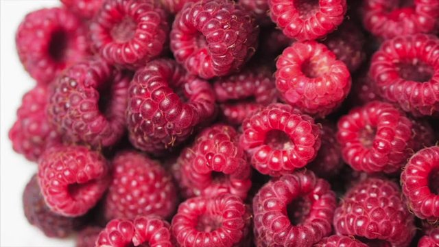 Close Up Rotation Loopable Berry. Fresh, Juicy Raspberry Background, Ripe. Macro Red Raspberries Fruit. Fresh Raspberry Fruits As Food Dackground. Healthy Food Organic Nutrition.