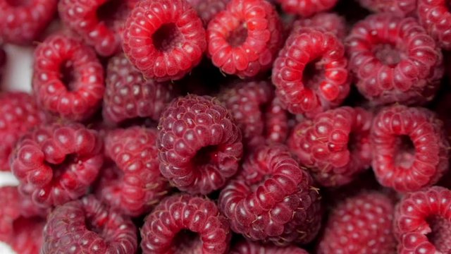 Close Up Rotation Loopable Berry. Fresh, Juicy Raspberry Background, Ripe. Macro Red Raspberries Fruit. Fresh Raspberry Fruits As Food Dackground. Healthy Food Organic Nutrition.