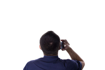 Rear view of modern adult man speaking on the phone over isolated white background, looking up