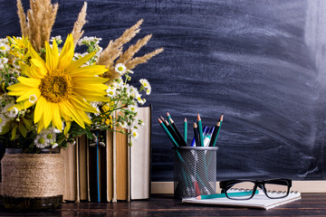 Teacher's day holiday greeting icon. Education knowledge concept. Wooden chalk board frame and vase...