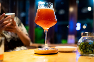alcoholic drinks cocktails on counter top in night club.