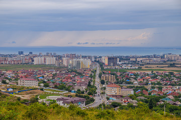 Fototapeta premium View of Anapa. View of the resort city. The vastness of Russia. Russian southern city. City from above. Many houses .. Buildings and architecture